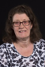 a woman with long hair wearing glasses