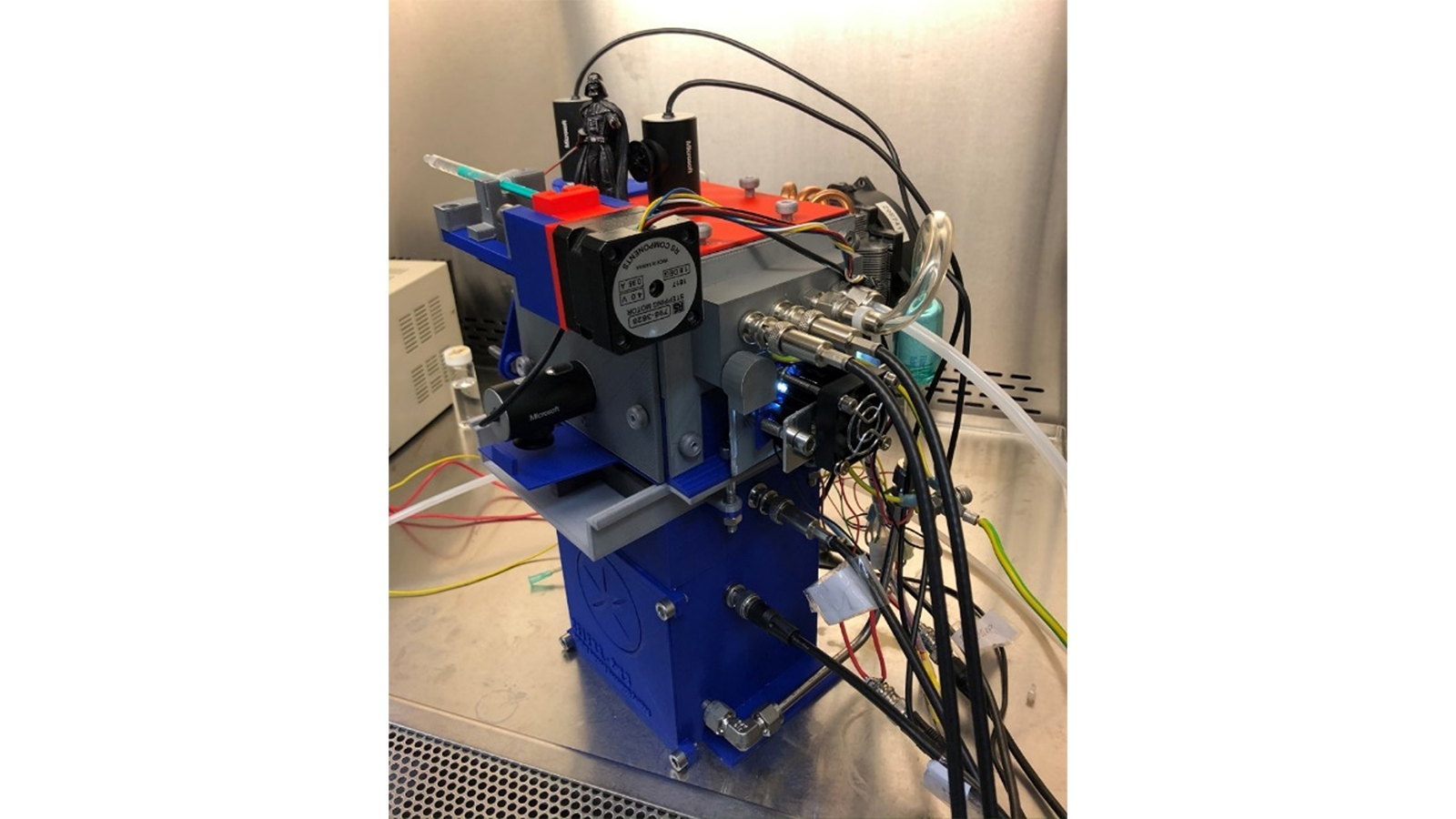 A machine with many wires used by the The PERFORM COVID-19 Team
