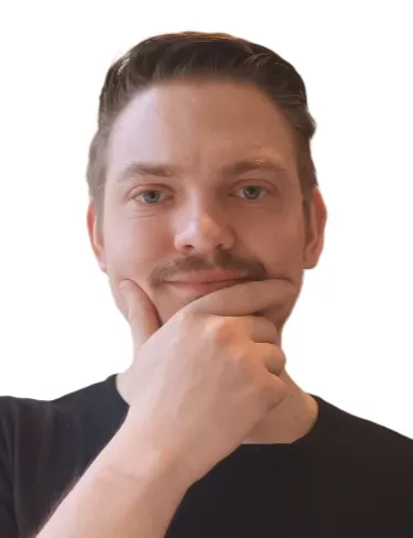 Fabian Liebig Fabian Liebig smiles gently while resting his chin on his hand in a thoughtful pose against a stark white background.