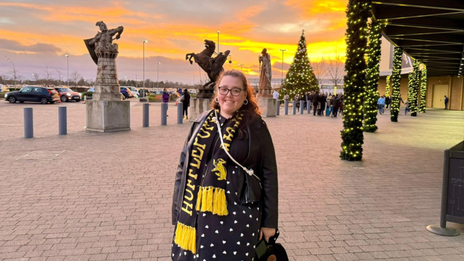 Naomi Shallcross - Member of the Did You Know prize winnng team outside in football scarf