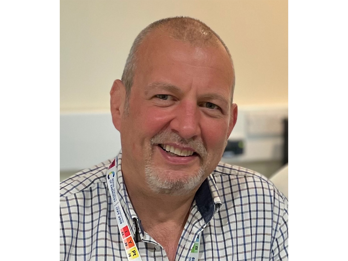Professor Duncan Graham in check shirt, smiling at the camera