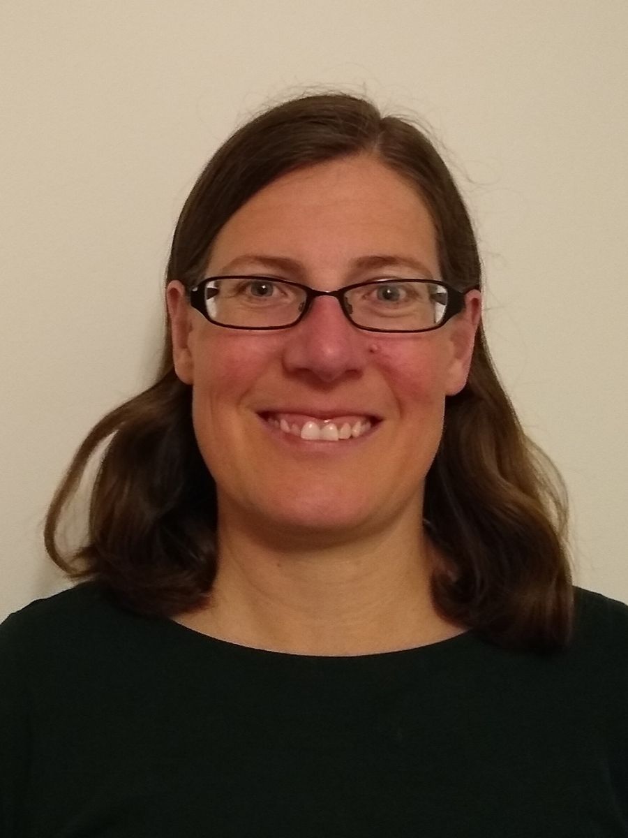 Maria Southall smiling to camera wearing glasses