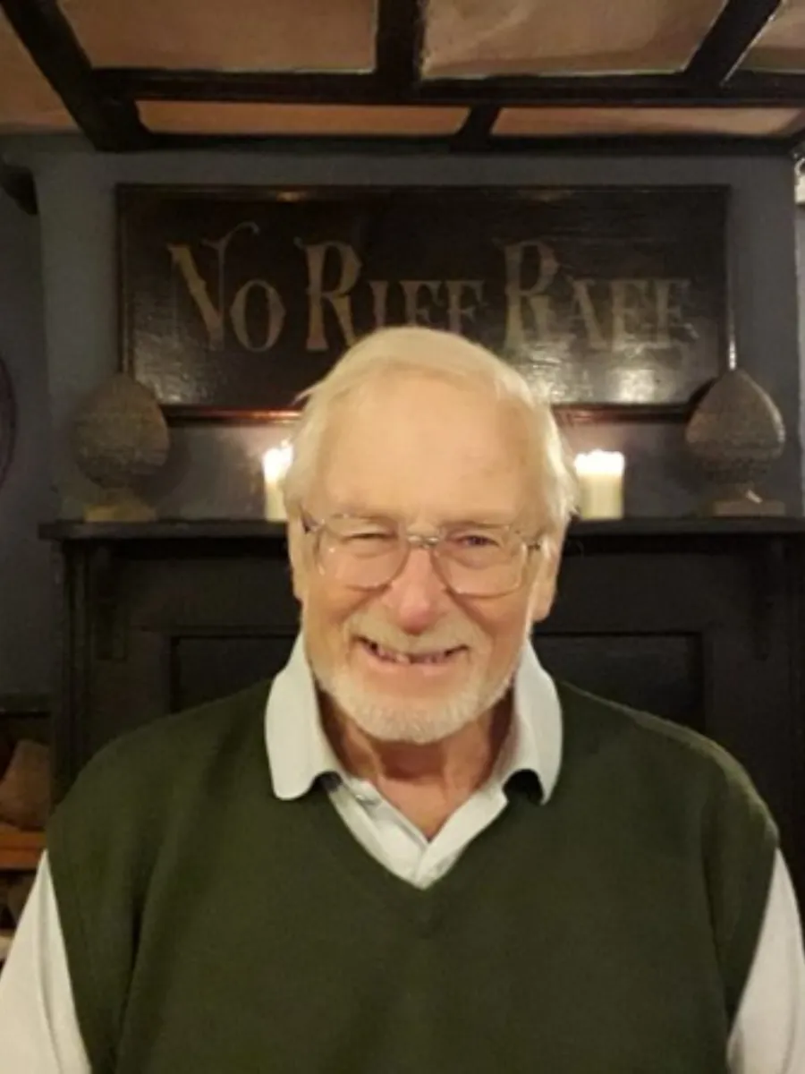 Clifford John Harris Dr Clifford John Harris wearing glasses and shirt in home setting, smiling broadly to camera