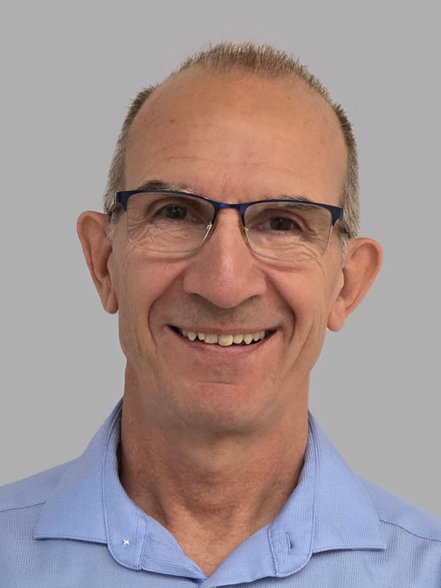 Vicente Talanquer smiling to camera in glasses