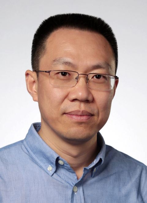 Yi-Tao Long headshot, wearing glasses and blue shirt