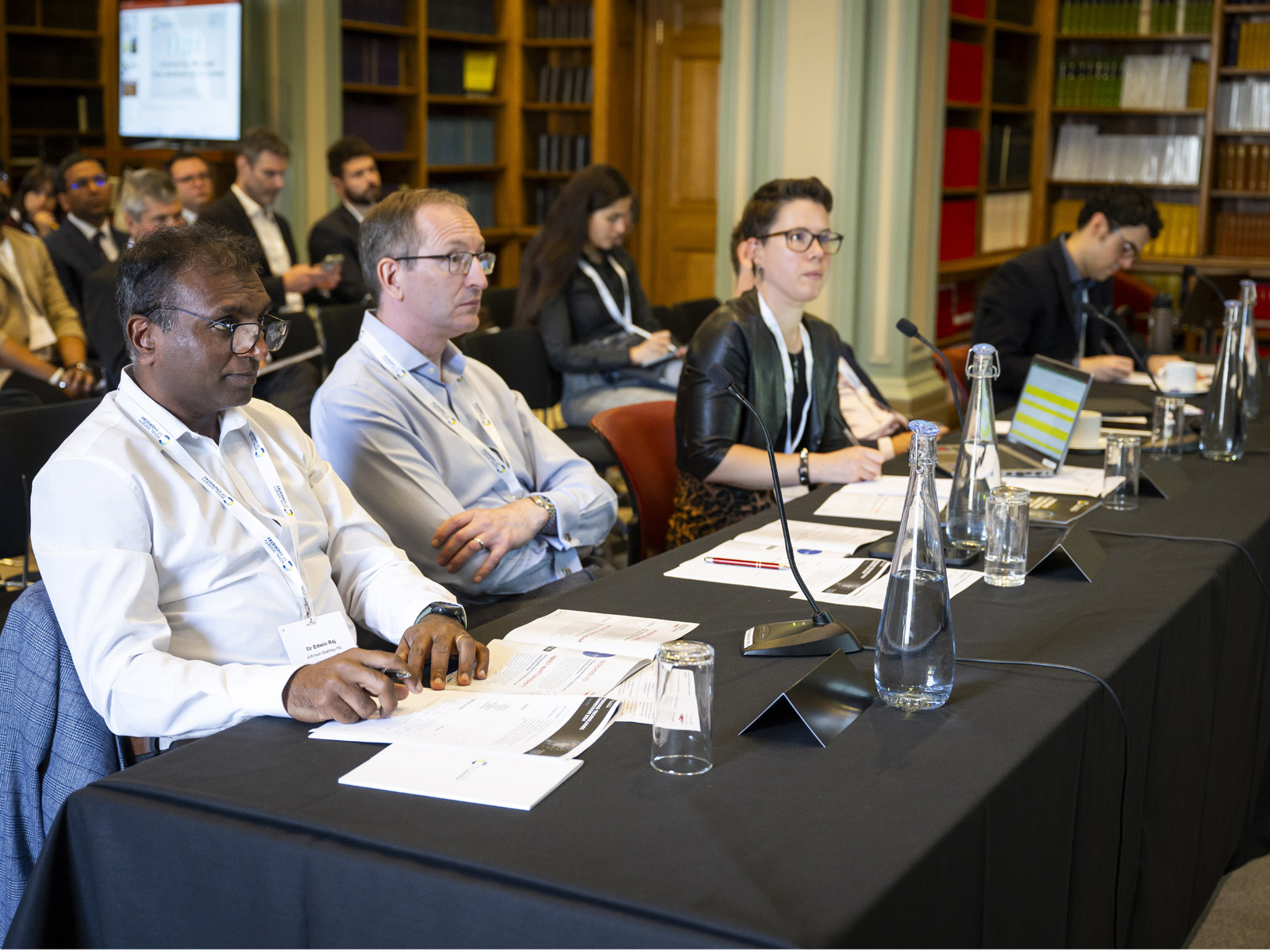 The judging panel looks on during one of the presentations at Burlington House