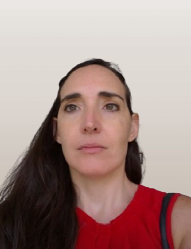 Headshot of Carmen Lerga wearing a red sleeveless top