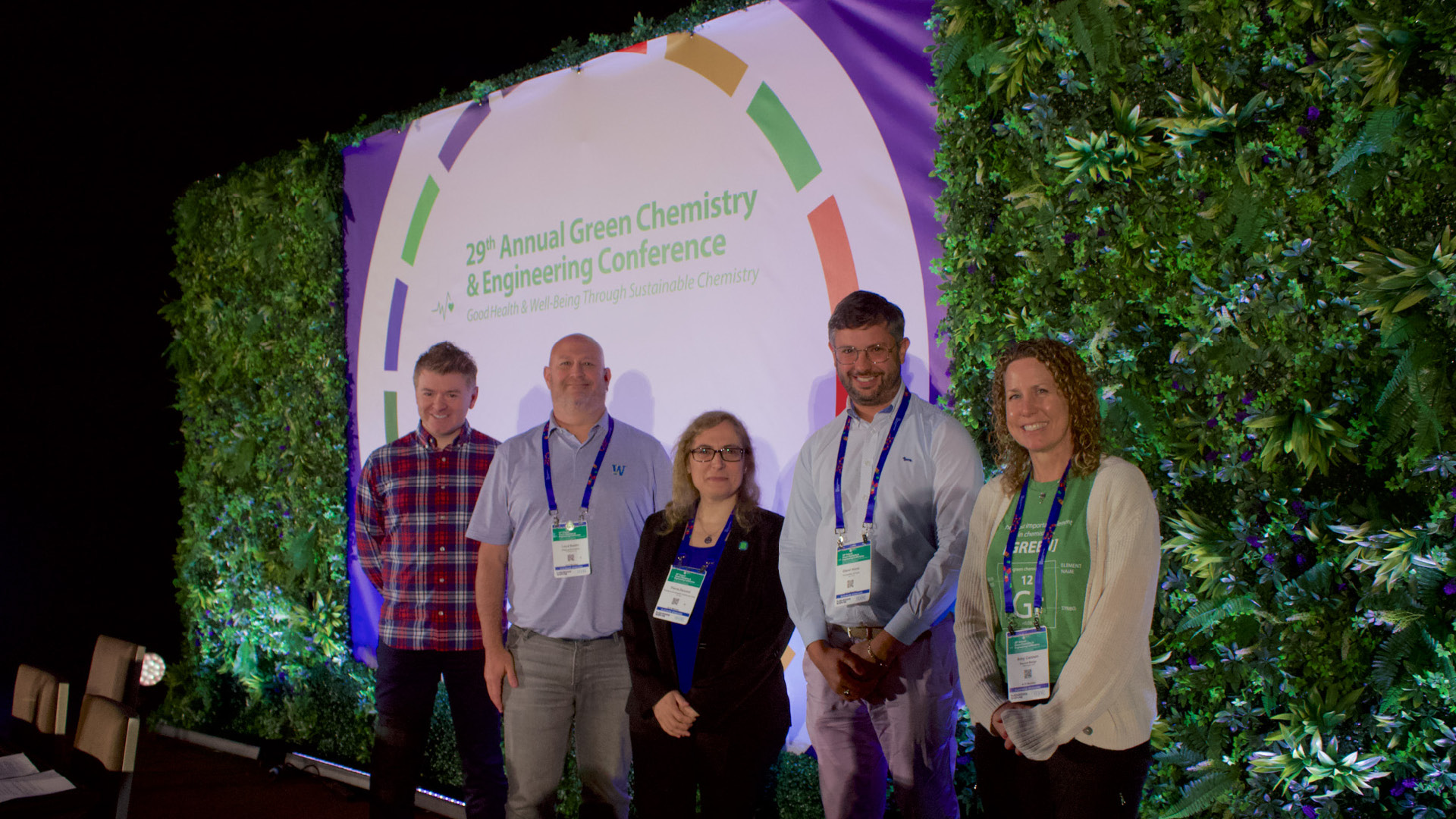 The Green Chemistry Commitment in front of signage posing for camera