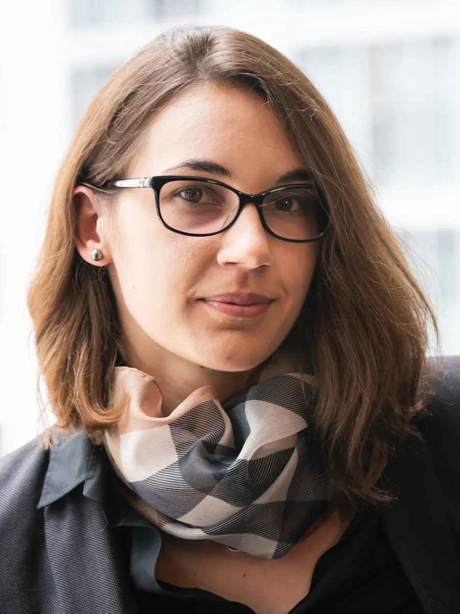 Jovana Milić Jovana Milić headshot to camera, wearing glasses and patterned scarf