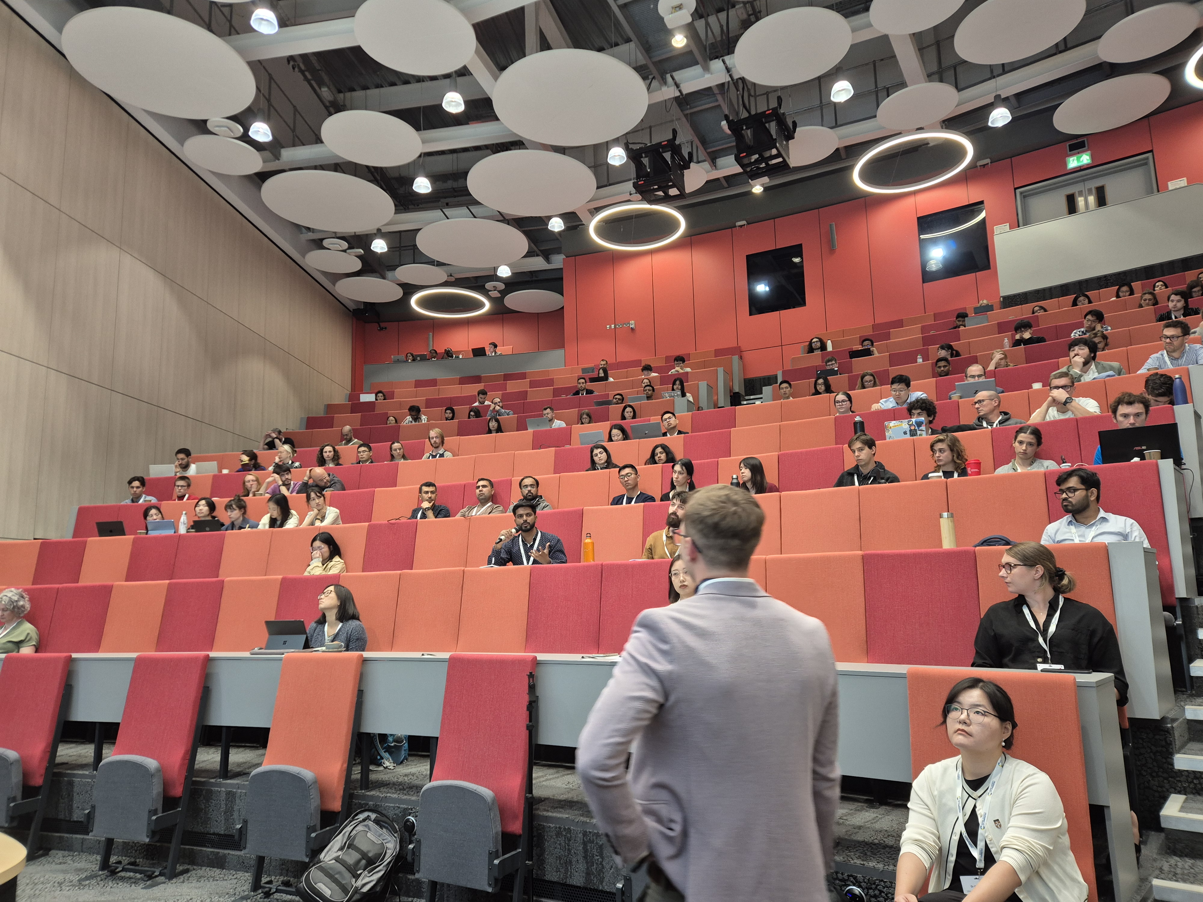 International Solar Fuels Conference - the audience watches one of the presentations (6) An audience sits in a lecture hall watching a presentation