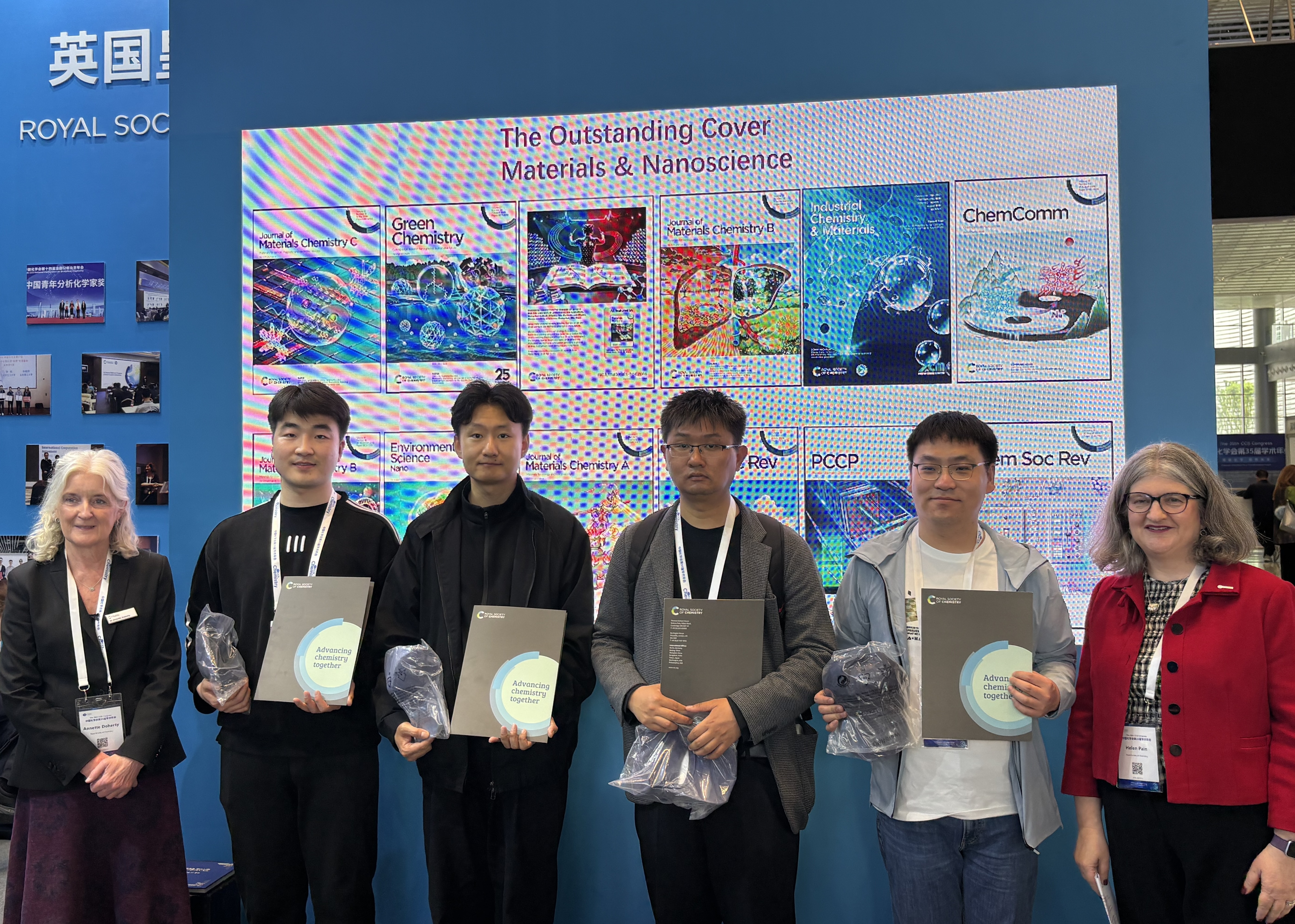 a group of people holding papers