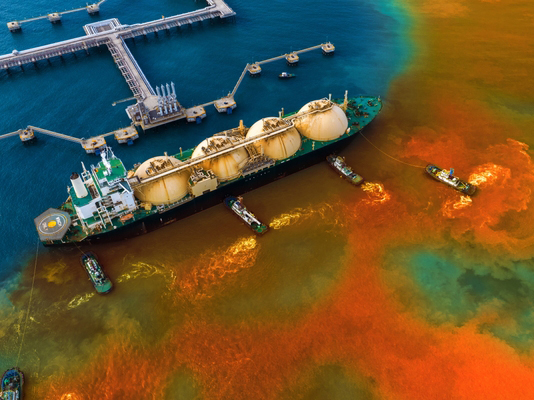 An oil spill from a ship showing surface water pollution