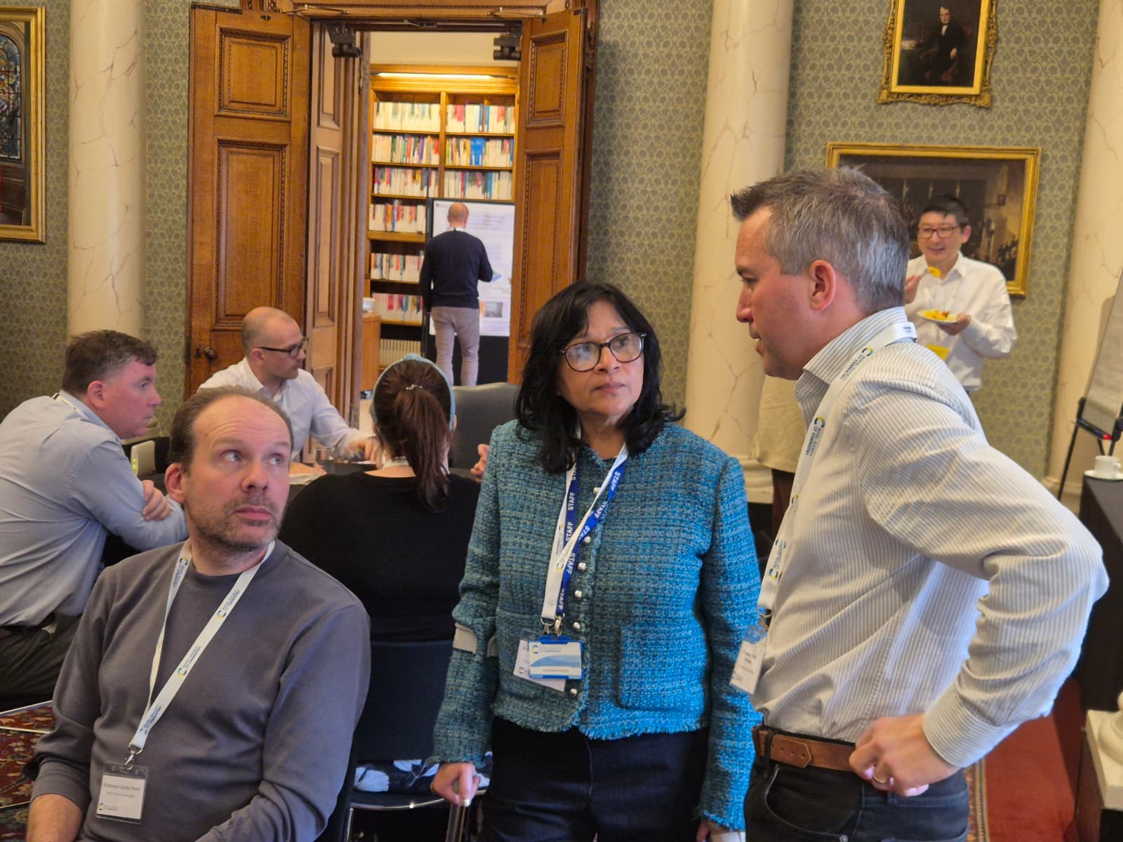 Sustainable PLFs 2040 Initiative Meeting - Professor Anju Massey-Brooker (centre) Professor Anju Massey-Brooker talks with two delegates, one either side of her, during lunch