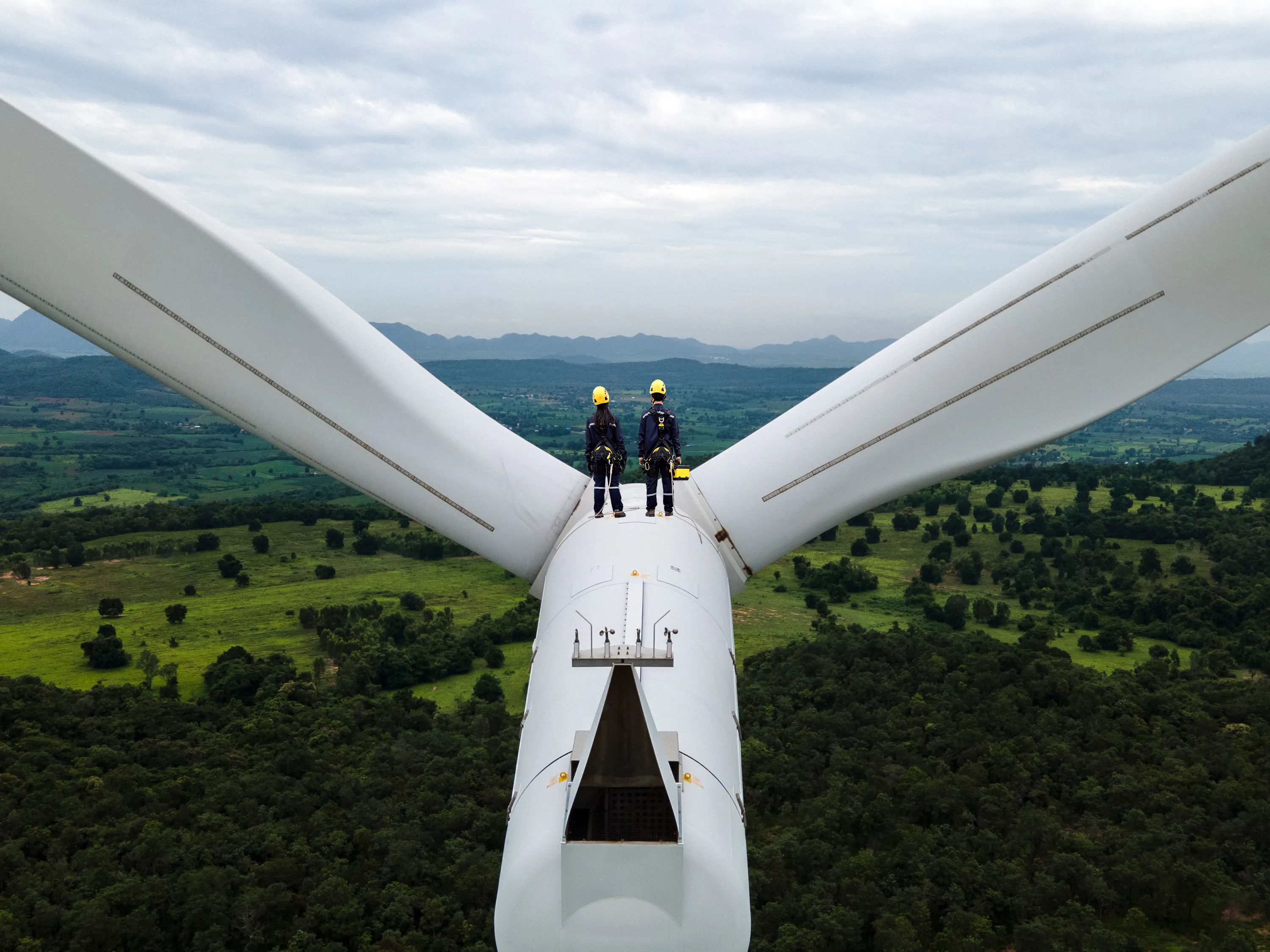 policy-campaigning-getty-1328659820 two people standing on top of a wind turbine looking out to the horizon