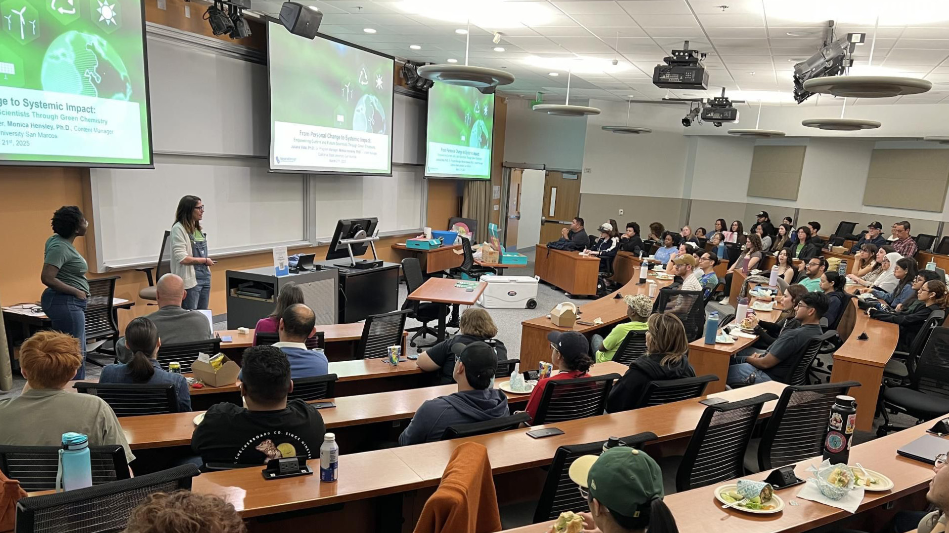 Some of the Green Chemistry Commitment team delivering a large lecture