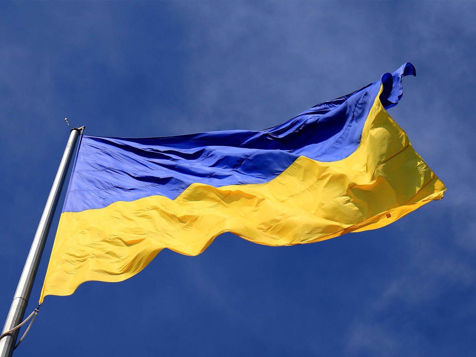 Ukraine flag with blue sky in background Ukraine flag with blue sky in background