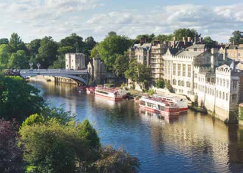 River in York with boats and buildings River in York with boats and buildings