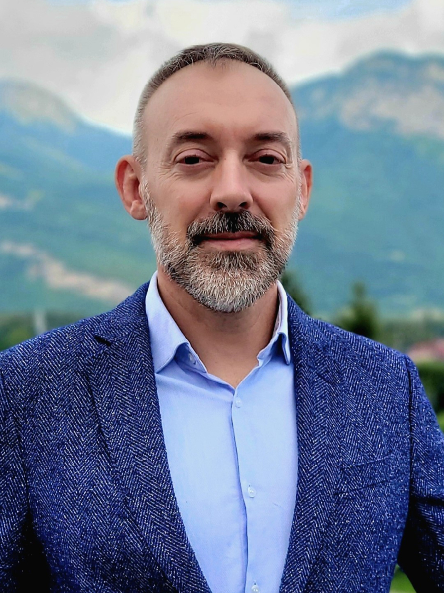 Renaud Demadrille to camera in blue jacket and shirt, taken outside