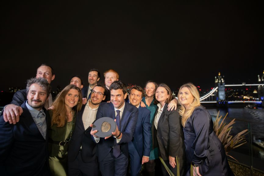 Members of the Notpla team celebrate winning the Earthshot Prize on a hotel balcony late at night