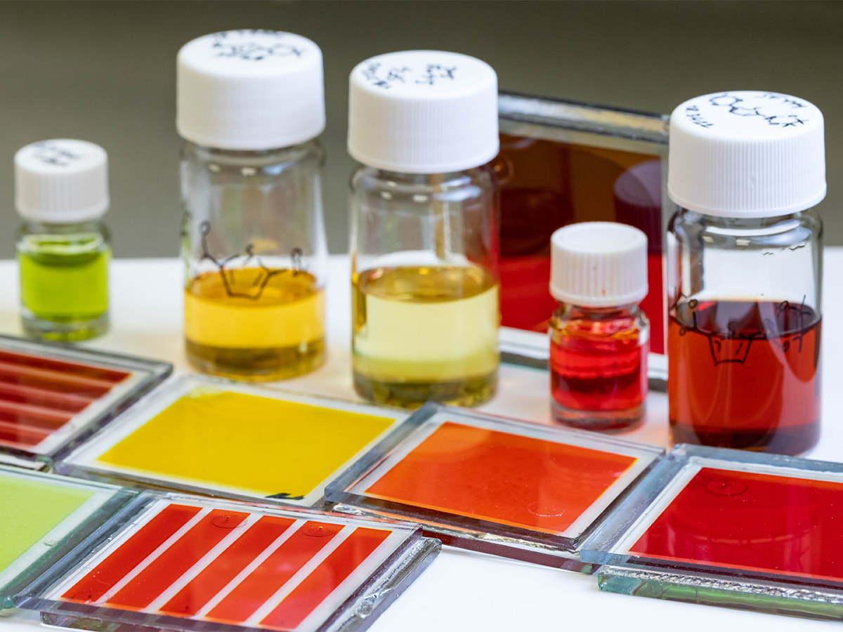 PISCO Team's specimens of different colored liquids in small bottles, with some liquids spread onto glass slides
