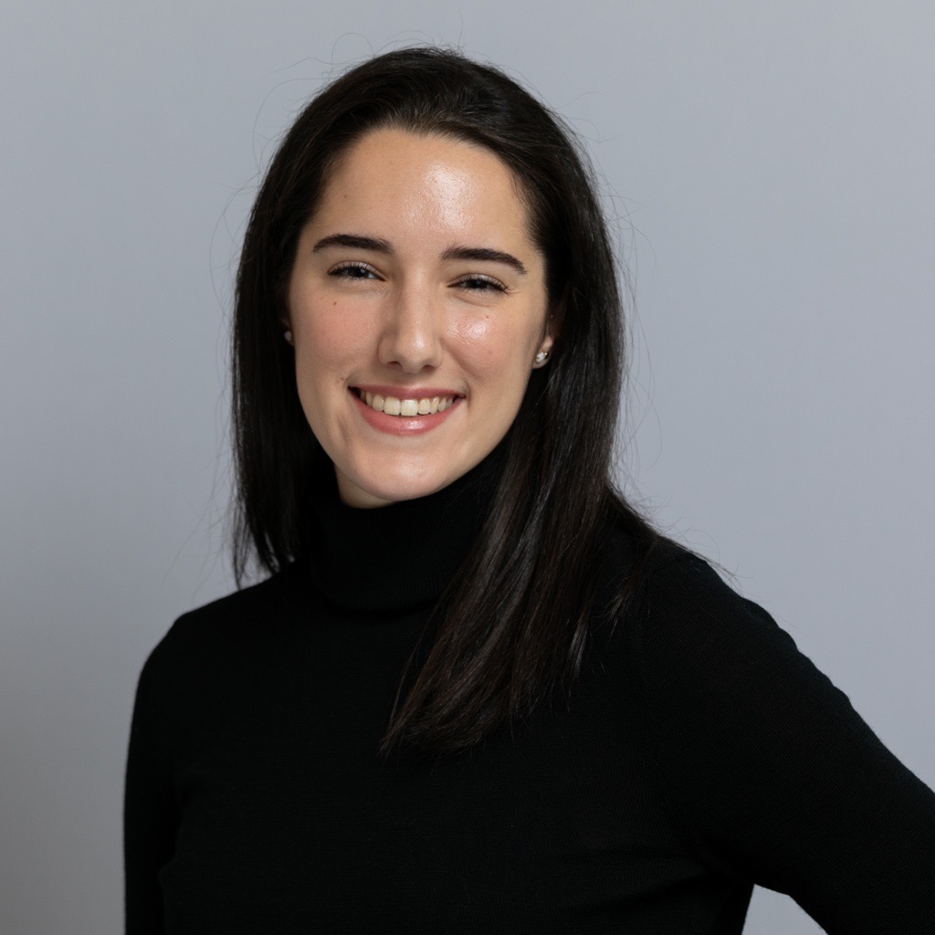 A heads-and-shoulders photo of a smiling Stephanie Metzger, who is wearing a black top.