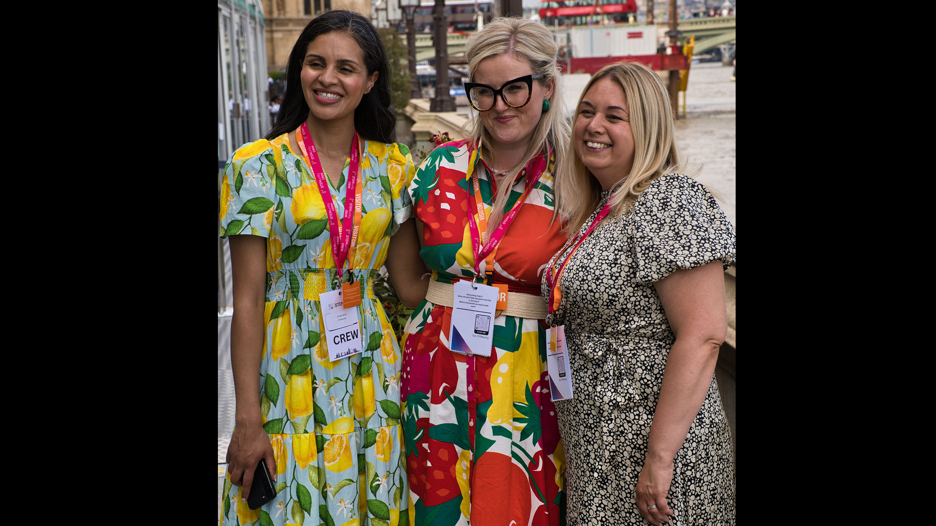 STEMunity team members in colourful dresses posing for camera
