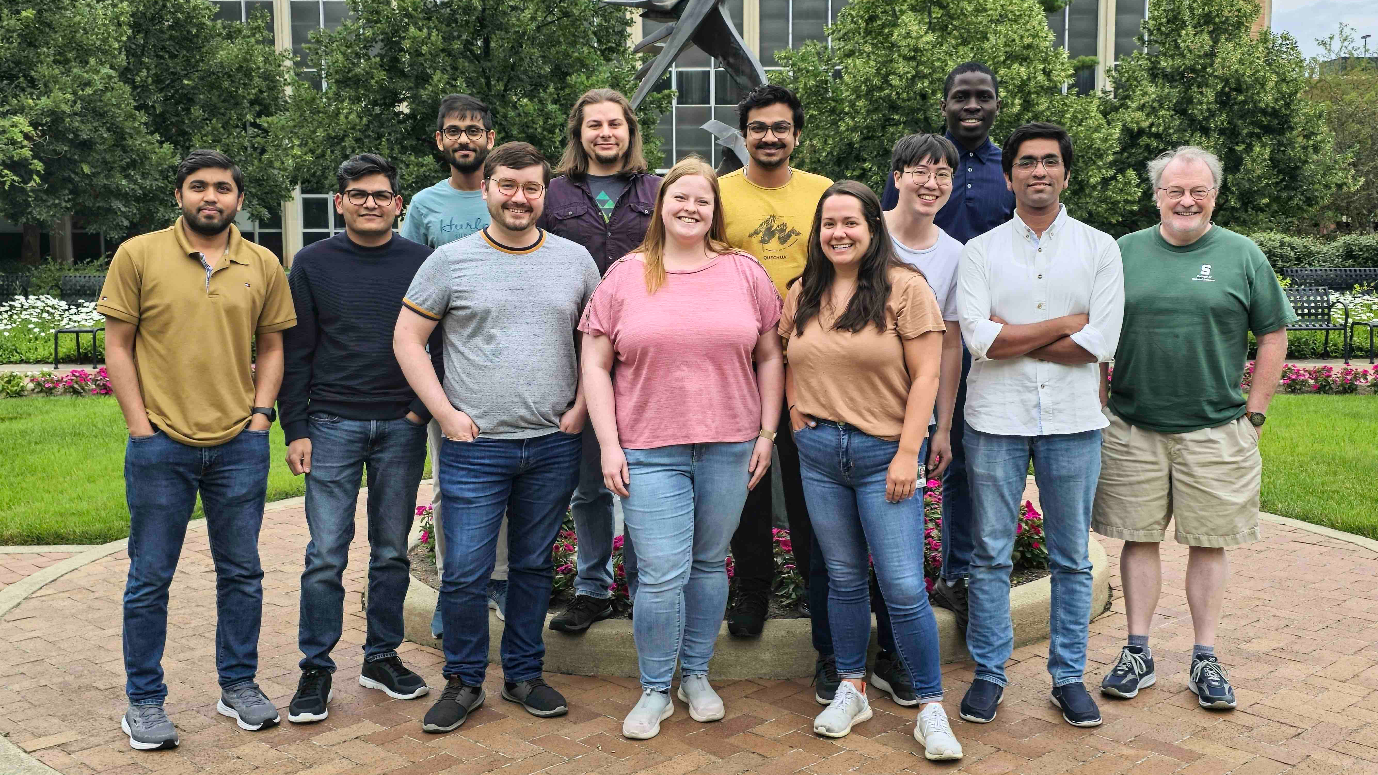 Professor James McCusker with a group of people smiling for the camera