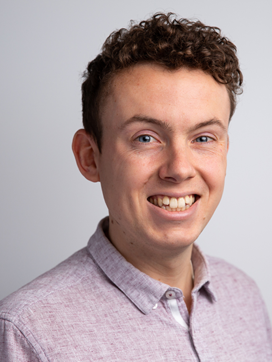 Callum Woof headshot smiling to camera