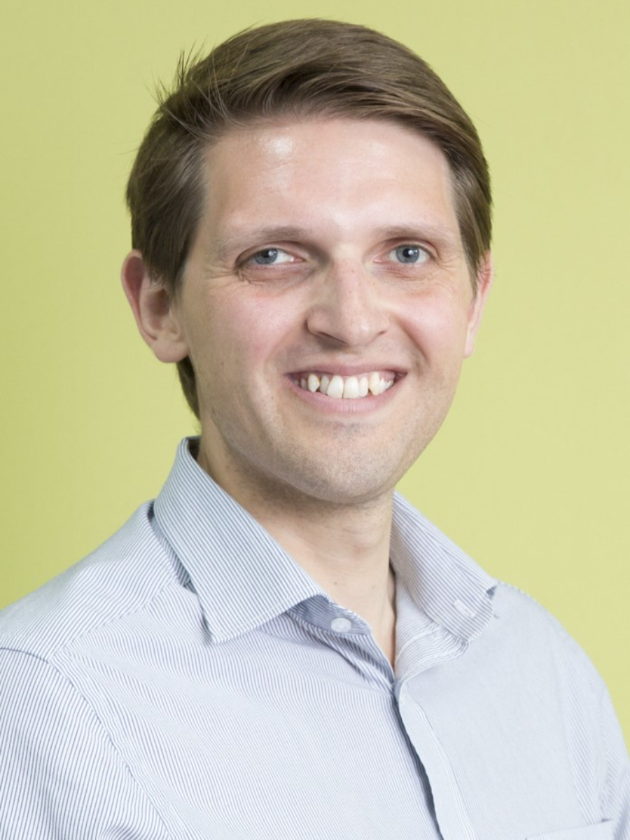 James Moore smiling to camera, headshot