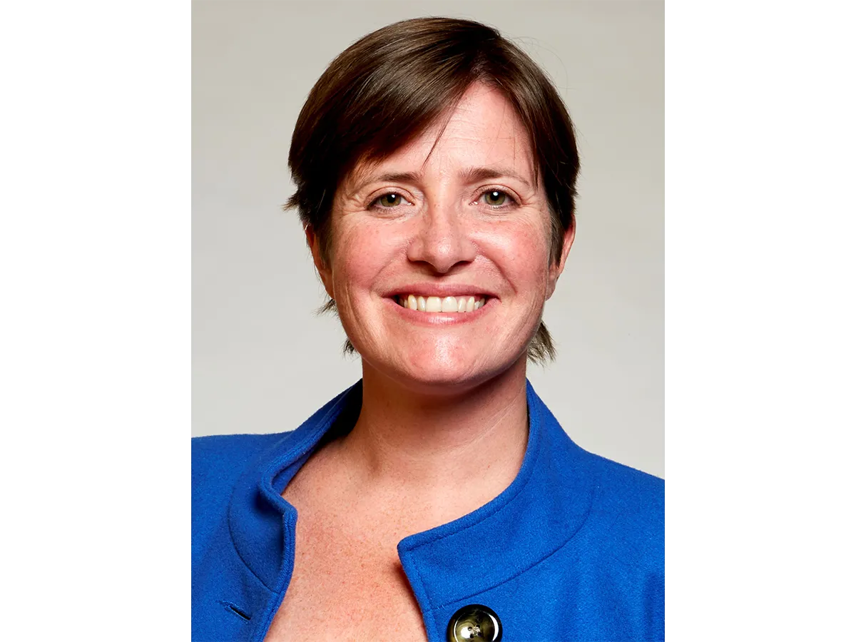 Professor Rachel O’Reilly in a blue jacket smiling for the camera