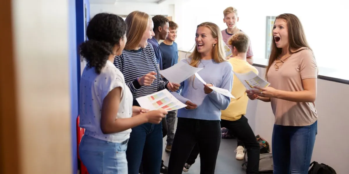 Exam results 2025 College or high school students from mixed races talking happily