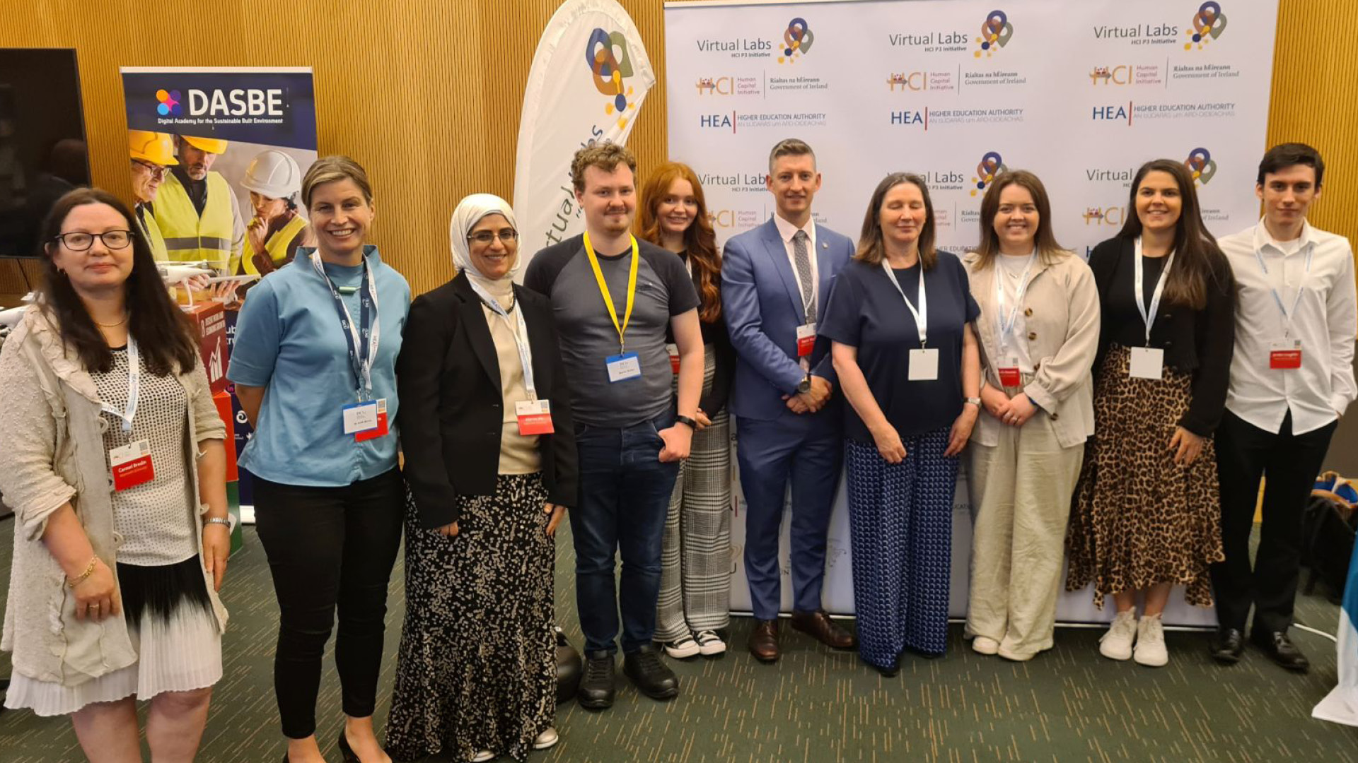 Virtual Labs Team all in a line posing for camera in every day clothes