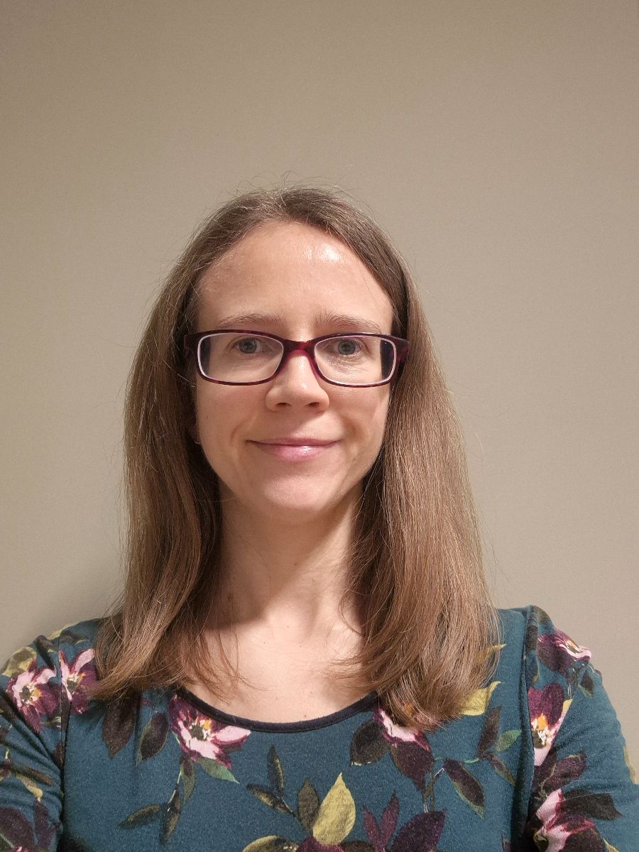 Donna Smith smiling to camera wearing glasses