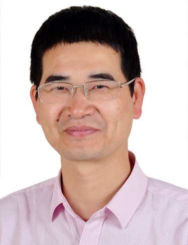Nanfeng Zheng smiling at camera wearing a light pink shirt and glasses