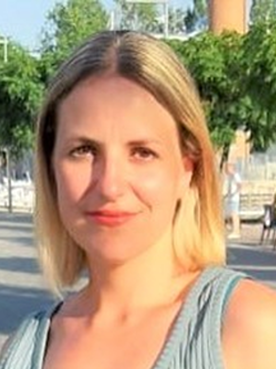 Letizia Bresciani headshot smiling to camera outdoors in sunllight