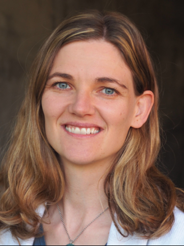 Headshot of Keriann Backus smiling at the camera