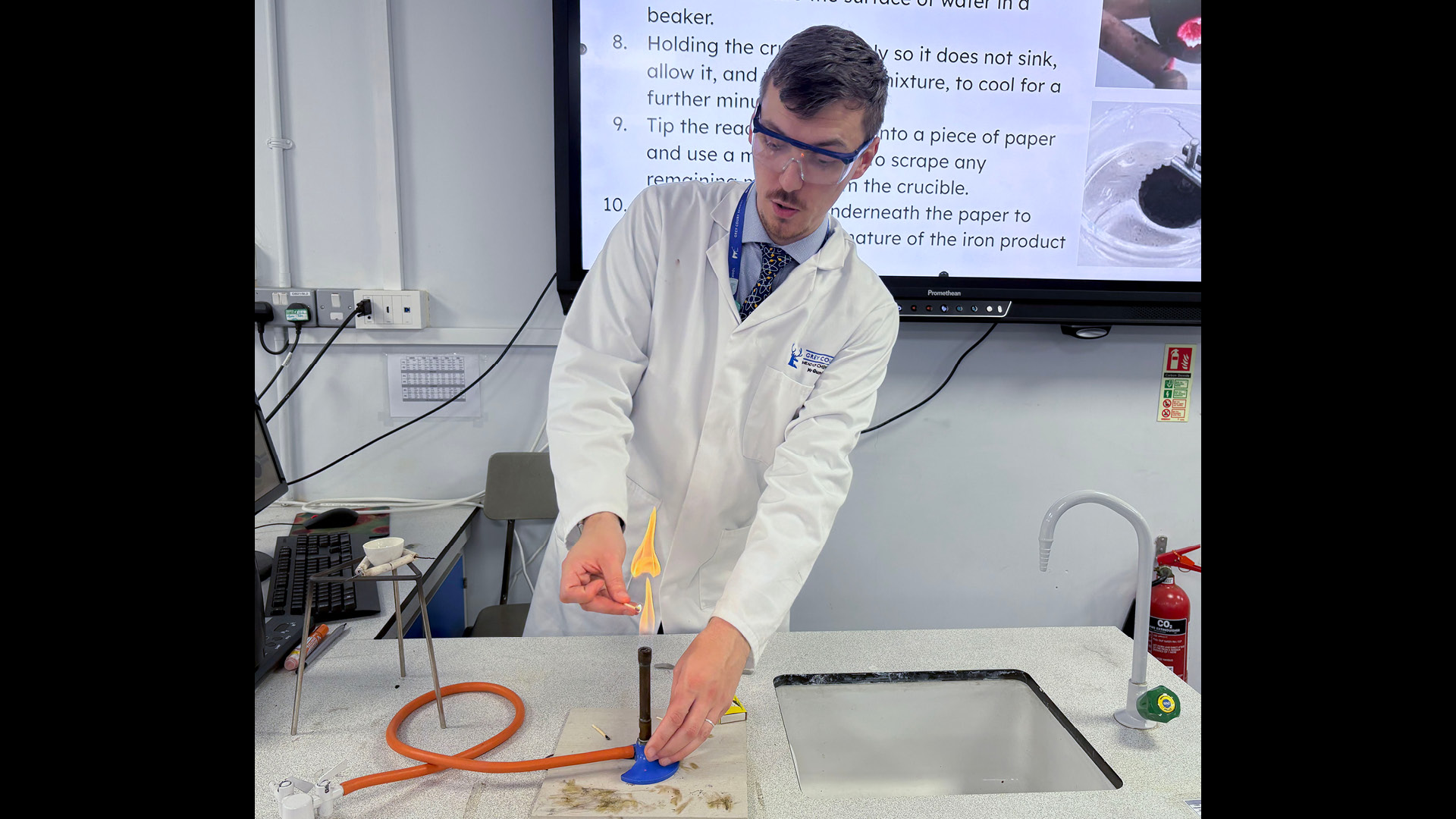 Matthew Gundry in lab with white board on carrying out a demo