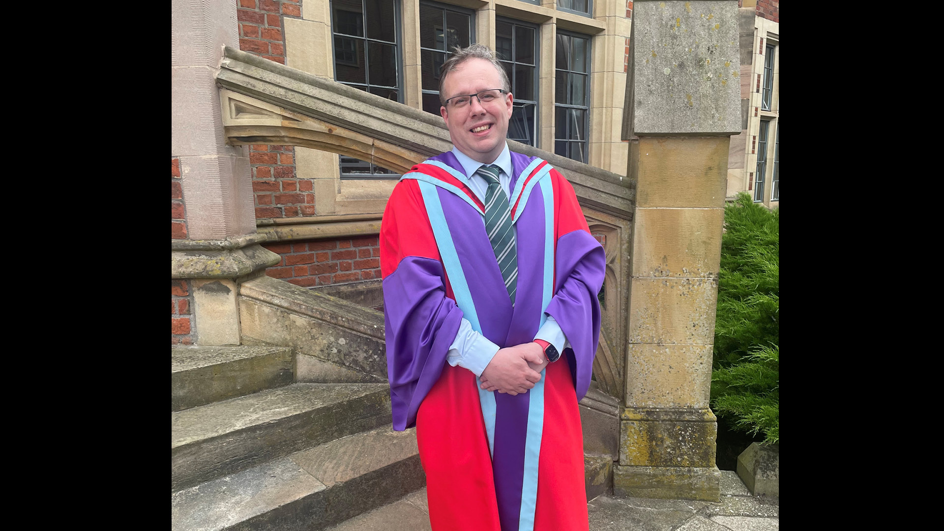 Kevin Morgan in graduation gown