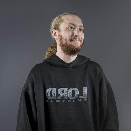 a man with a beard wearing a black sweatshirt