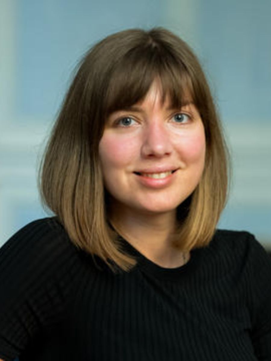 Professor Ludmilla Steier smiling to camera in black top