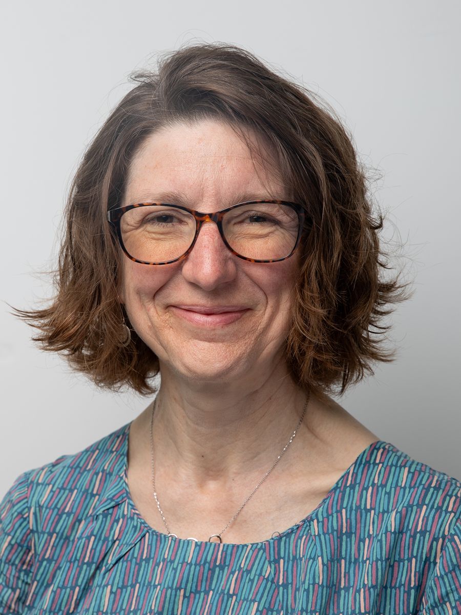 Lisa Clatworthy smiling to camera wearing glasses