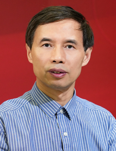 Portrait of Yongfa Zhu in a blue striped shirt against a red backdrop