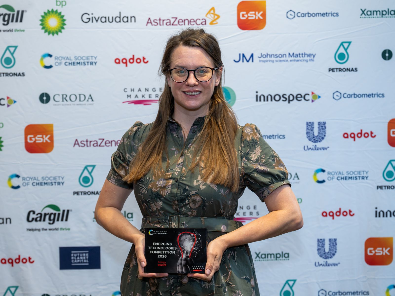 Gavion founder Professor Abbie Trewin holds a plaque