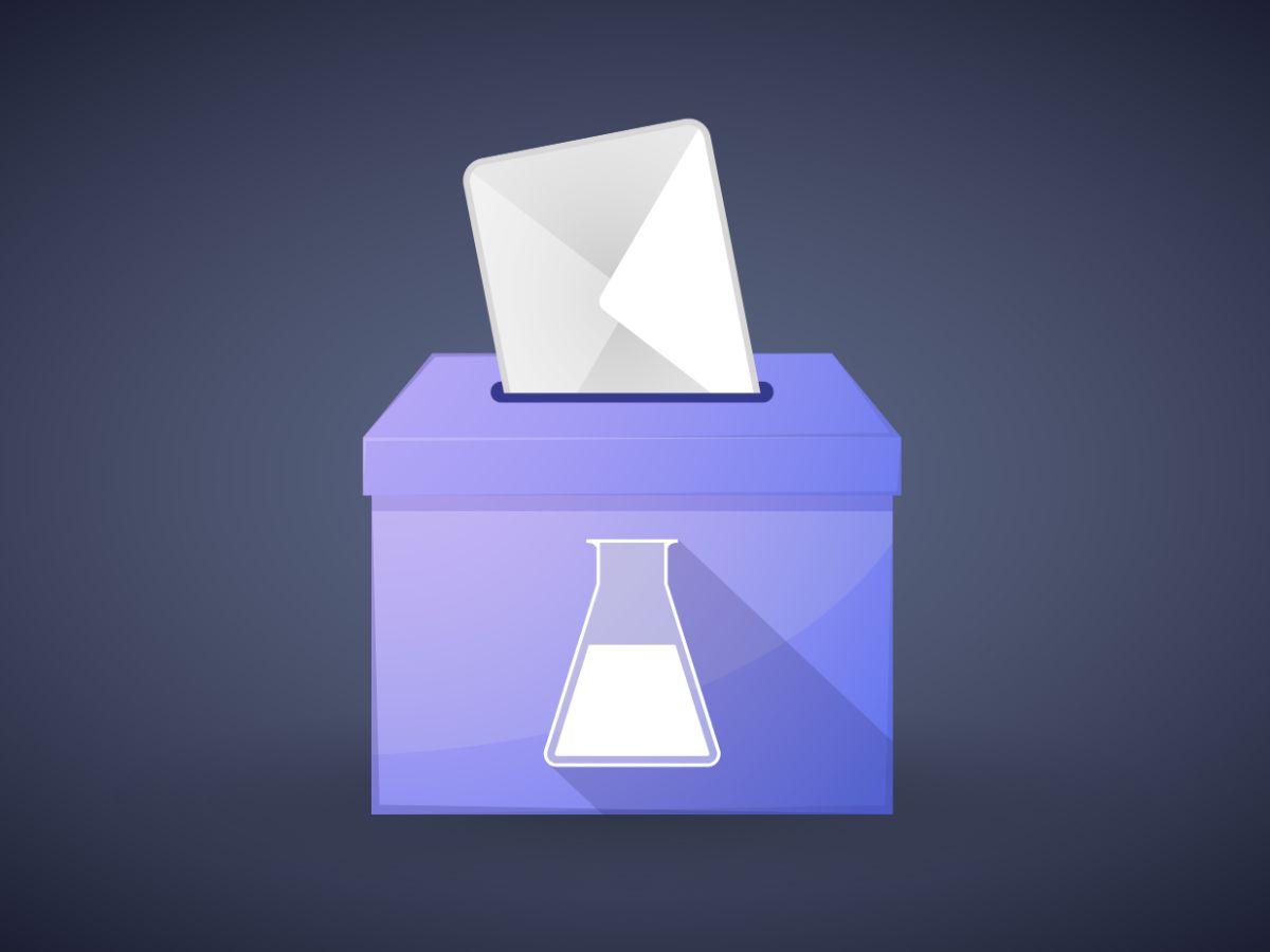 Box with chemist flask on front and voting envelope being placed in top slot