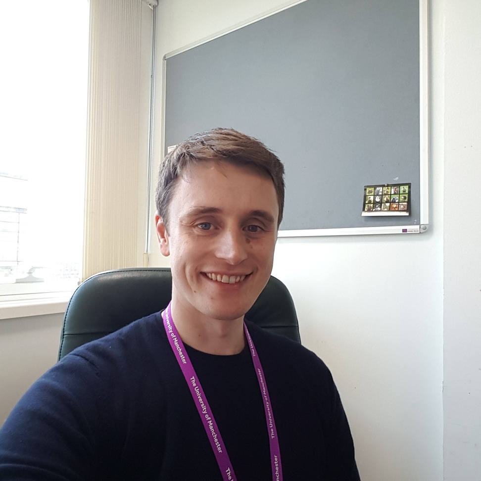 a man sitting in a chair smiling