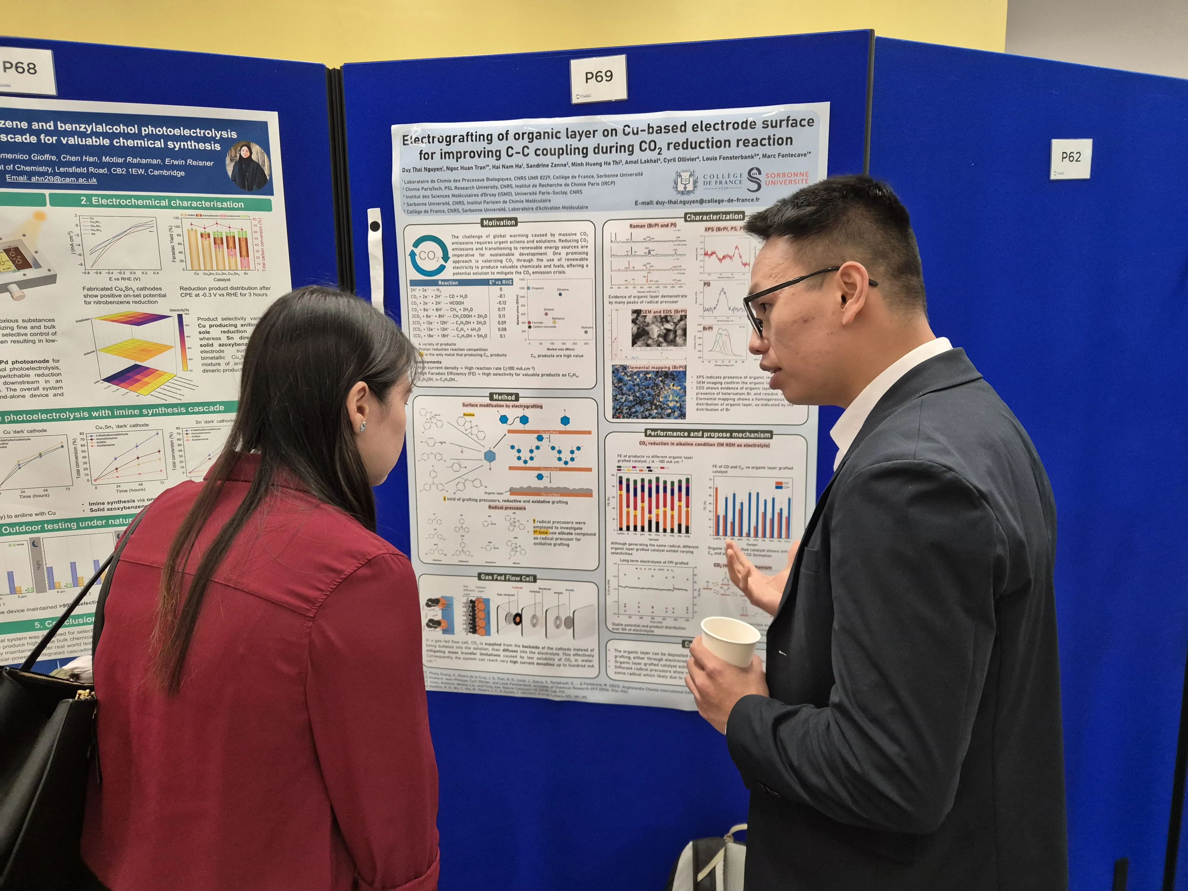 International Solar Fuels Conference - discussion by the poster presentations Delegates talk at the International Solar Fuels conference, with a poster in the background