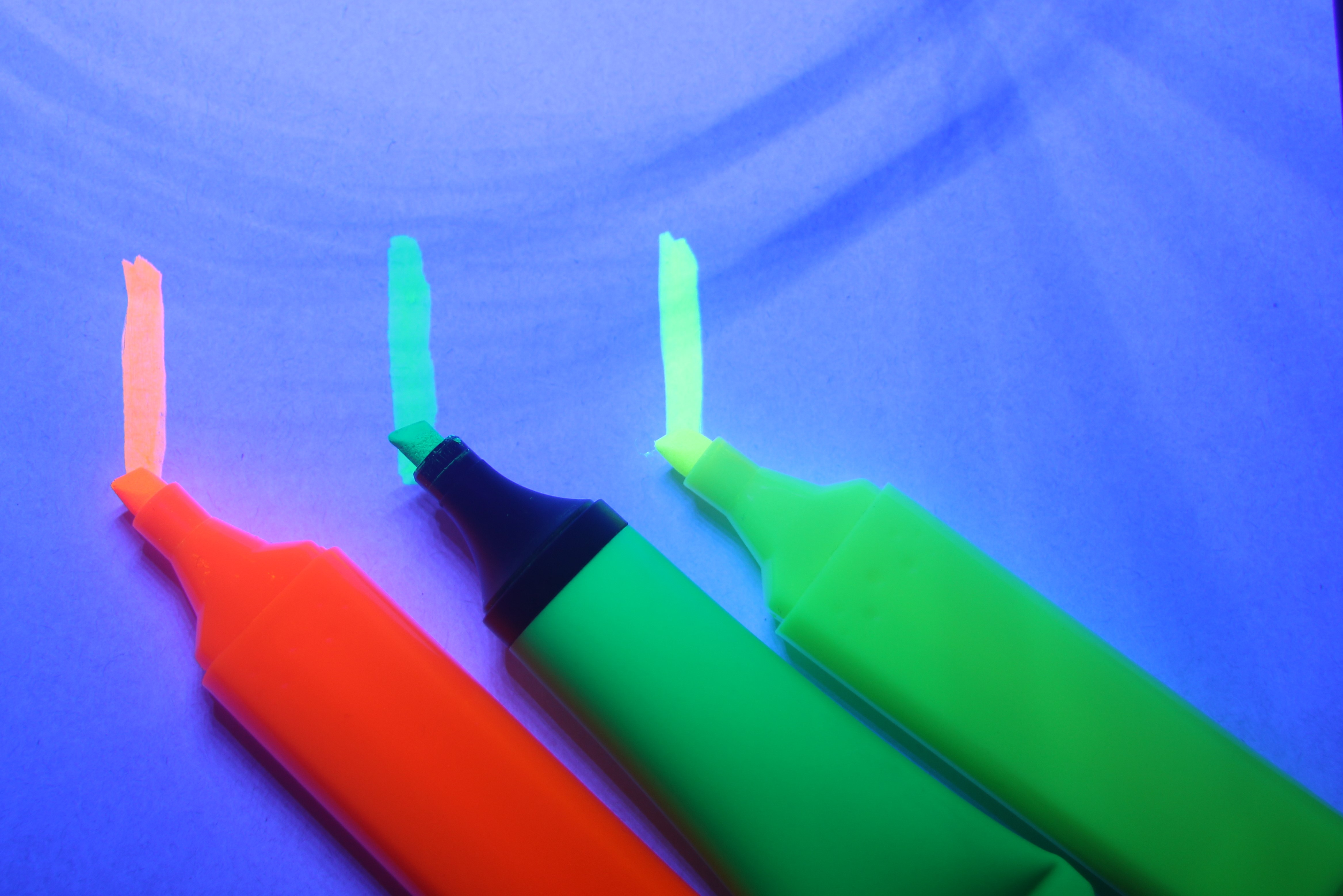 Stefan Simic's 'Highlight of the Month' shows three highlighters - one red, one green, one yellow - drawing a line on a blue piece of material