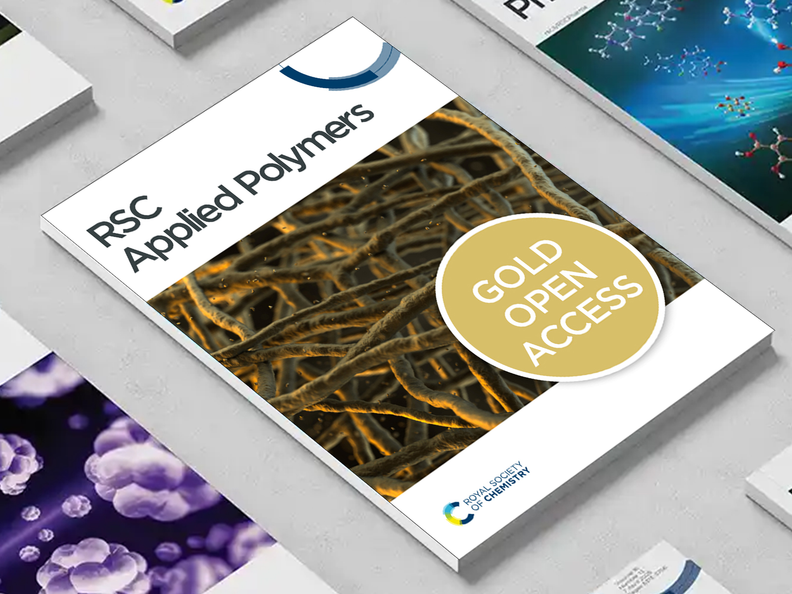 the RSC Applied Polymers journal among a group of other journals on a desk