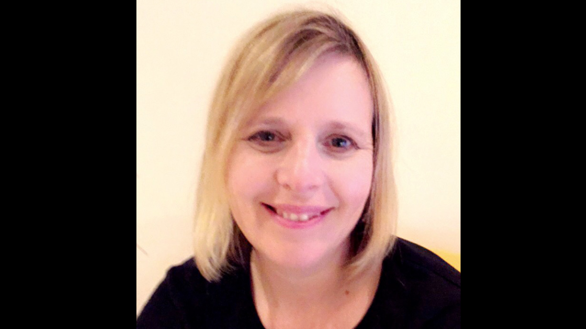 Team member Julia Nash Did You Know smiling to camera in black top