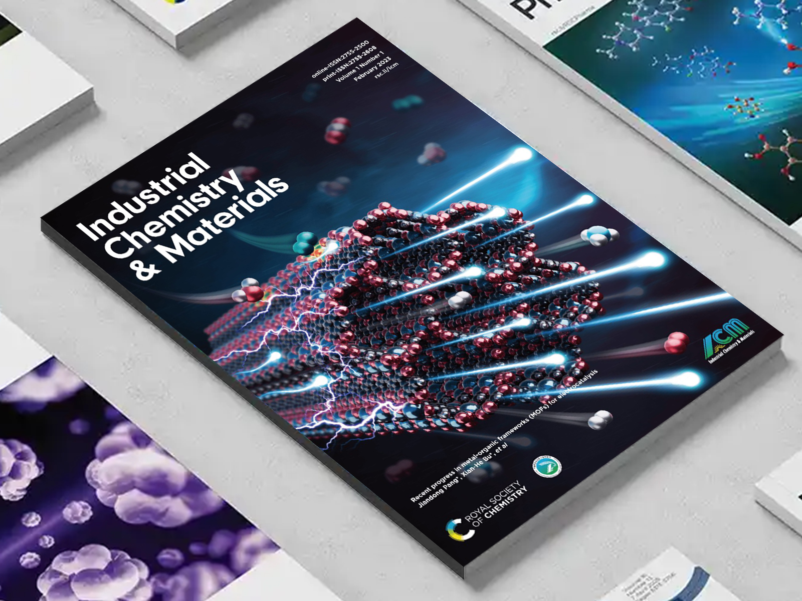 the Industrial Chemistry & Materials journal among a group of other journals on a desk